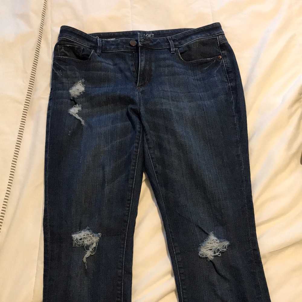 Jeans with distressed marks